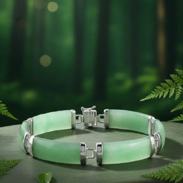 This elegant bracelet harmoniously blends the deep, serene green of natural jade with the timeless luster of polished silver. A …