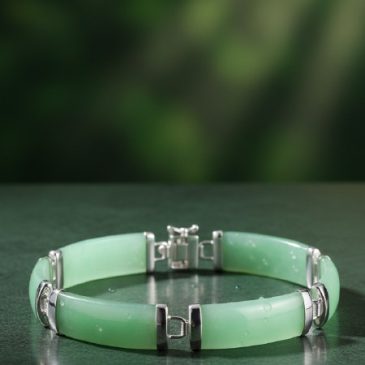 This exquisite handcrafted bracelet features genuine nephrite jade beads paired with a sleek 925 sterling silver charm. A perfec…