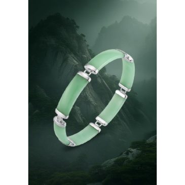 This elegant bracelet features smooth, polished green jade beads paired with a refined sterling silver charm. Its minimalist des…