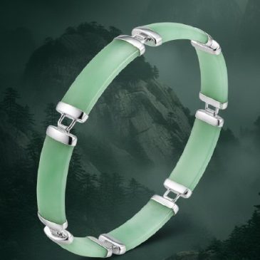 This elegant bracelet features high-quality green jade beads paired with handcrafted silver accents. A perfect blend of traditio…