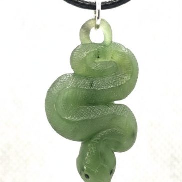 Radiate elegance with this striking nephrite snake pendant. The rich green gemstone body coils with sculptural grace, illuminate…