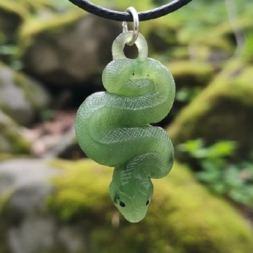Crafted from deep green nephrite, this elegant snake pendant features striking red garnet eyes. A timeless symbol of rebirth and…