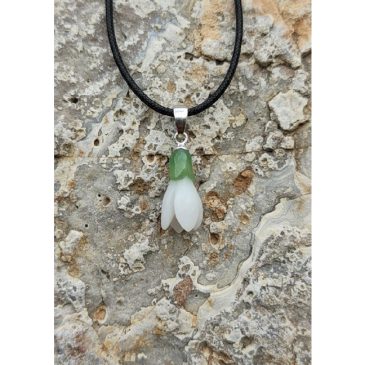 This elegant Snowdrop Pendant features a delicate contrast of white and green nephrite jade. Inspired by the first flower of spr…