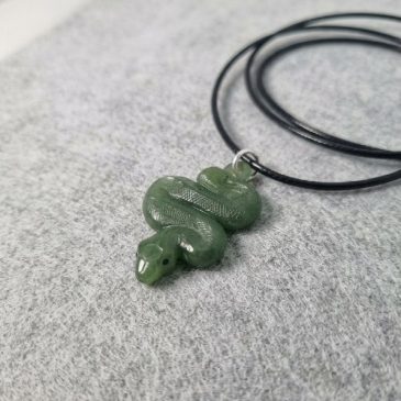 Jade snake pendant: timeless elegance and ancient wisdom. Hand-carved green nephrite. #jadesnake #nephrite #pendant #carvedjade…