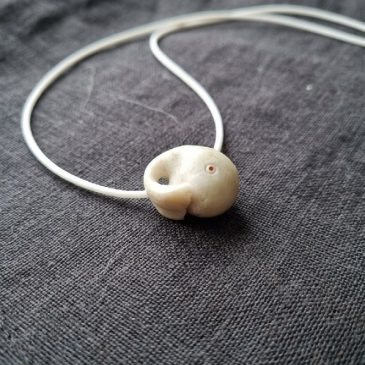Exquisite Moby Dick pendant crafted from pure white jade. Featuring precision-faceted gemstone eyes, this piece blends literary …