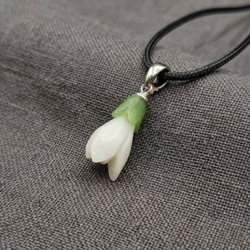 Snowdrop pendant crafted from natural white and green jade. A unique handmade piece. #jade #pendant #jewelry…