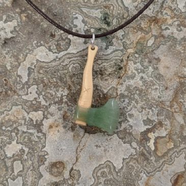 A handmade axe pendant, crafted with care. Featuring nephrite jade and petrified wood, it’s a unique and stunning piece. #handma…